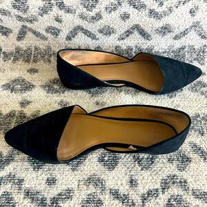 Black pointed toe flats.